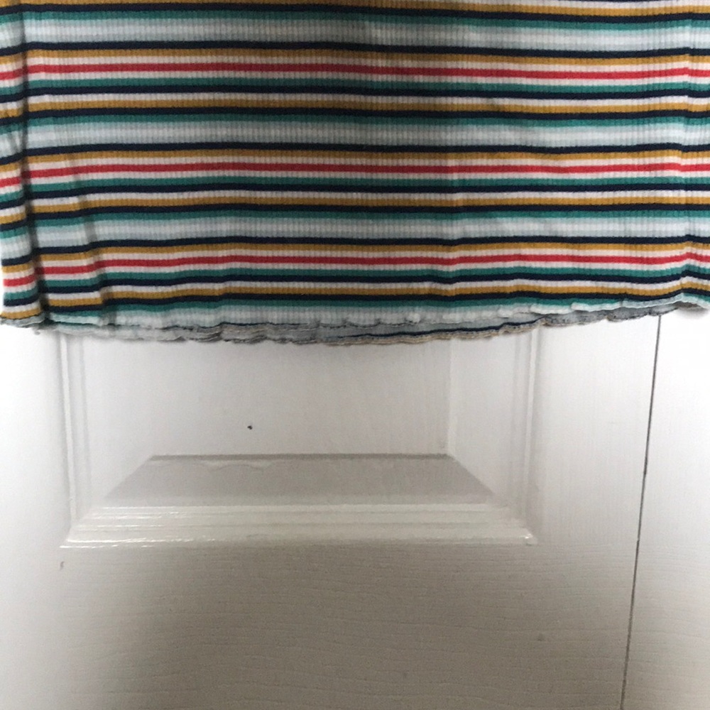 A striped blue,green,white,red,yellow t-shirt. - Picture 3 of 4